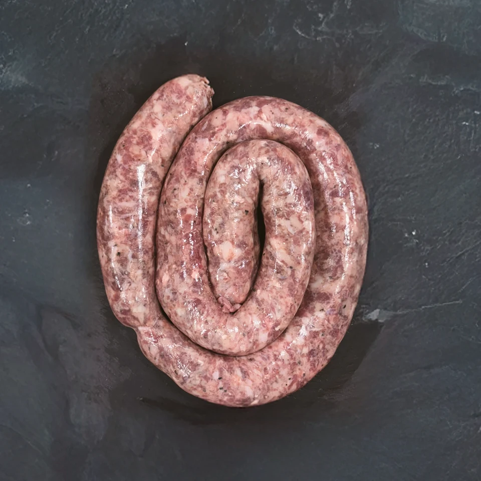 Coiled Procter&rsquo;s sausage on a slate board